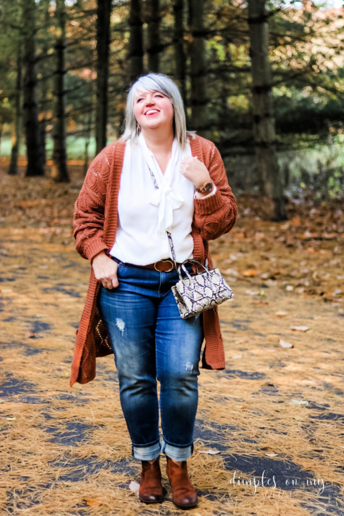 Long, rust cardigan, denim and snake print create a fall outfit for plus size women and straight sized women alike. #plussizefashion #fashionforwomenover50 #agelessstyle #rustcardigan #affordablefashion