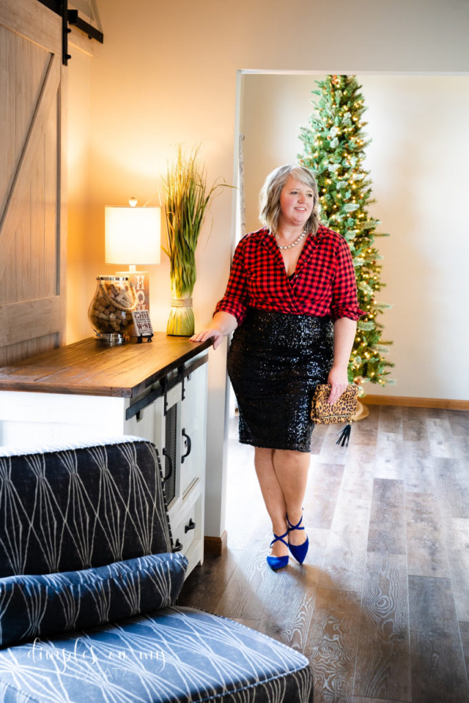Black sequin pencil skirt, buffalo plaid flannel shirt, blue pointed toe pumps and leopard print clutch  ||  Holiday party style with a flannel shirt  ||  How to style one flannel shirt into three party looks  ||  #holidaypartystyle #partyfashionforplussizewomen  #fashionforwomenover50 #partystyleforwomenover40