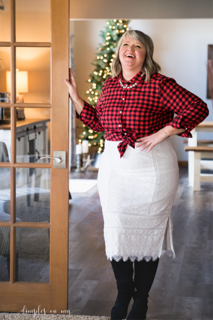 Buffalo plaid flannel shirt, white lace pencil skirt and black knee boots || Holiday party outfit with buffalo plaid shirt || How to style a buffalo plaid flannel shirt for a party || #plussizefashion #fashionforcurvywomenover40