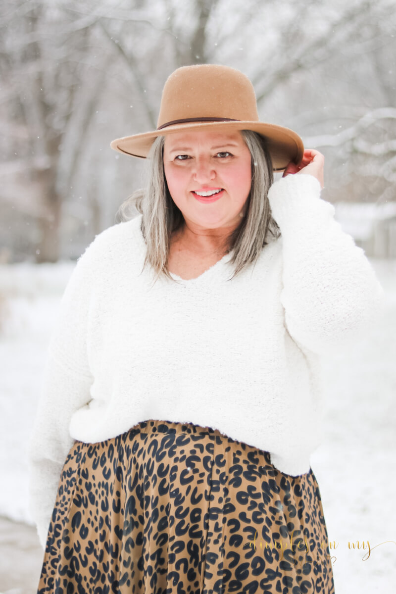 A leopard print maxi skirt and cozy sweater create an enchanting  holiday outfit.   #plussize #midsize #over50fashion