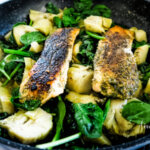 This savory salmon recipe is not only a quick and healthy recipe for your weeknight dinners, it's a one pot supper. #salmon #salmonrecipe #artichokerecipe #spinachrecipe #onepotmeal #mediteraniandiet