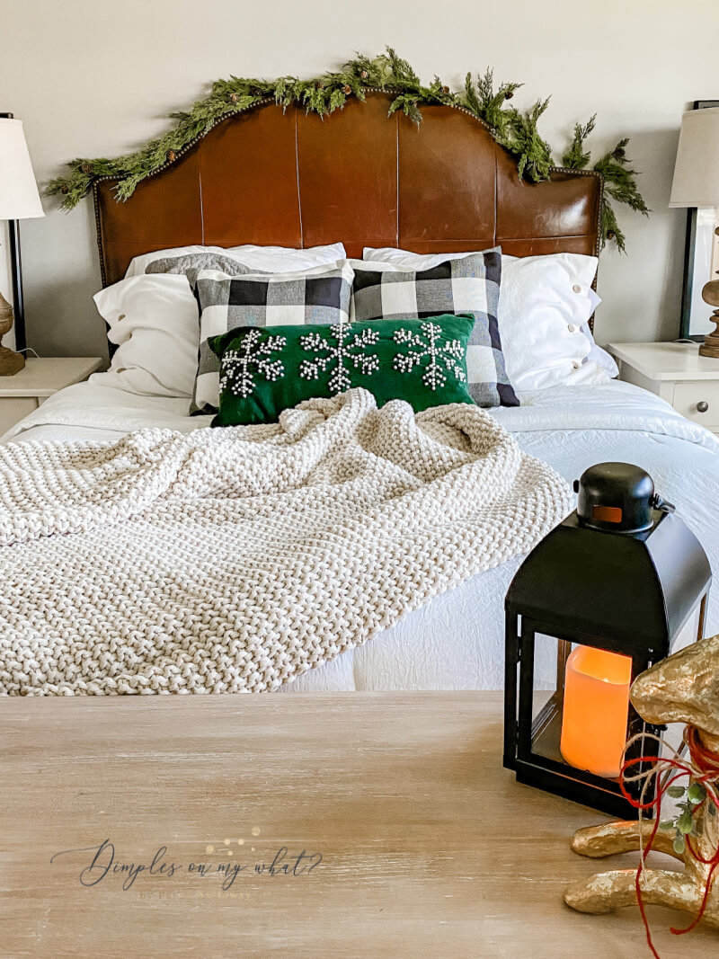 Don't forget to add some greenery and maybe a lantern to your bedroom for a simple bedroom Christmas decor. 