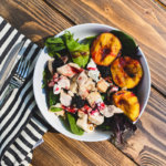 This delicious Grilled Peach Salad is as beautiful as it is delicious. And it comes together quickly with beautiful inseason produce. #summersaladrecipe #grilledpeaches #summersalads #blackberrysalad #lemonblackberryrecipes