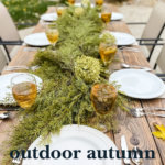 Create this gorgeous outdoor autumn tablescape using faux Christmas garland and things you already own.