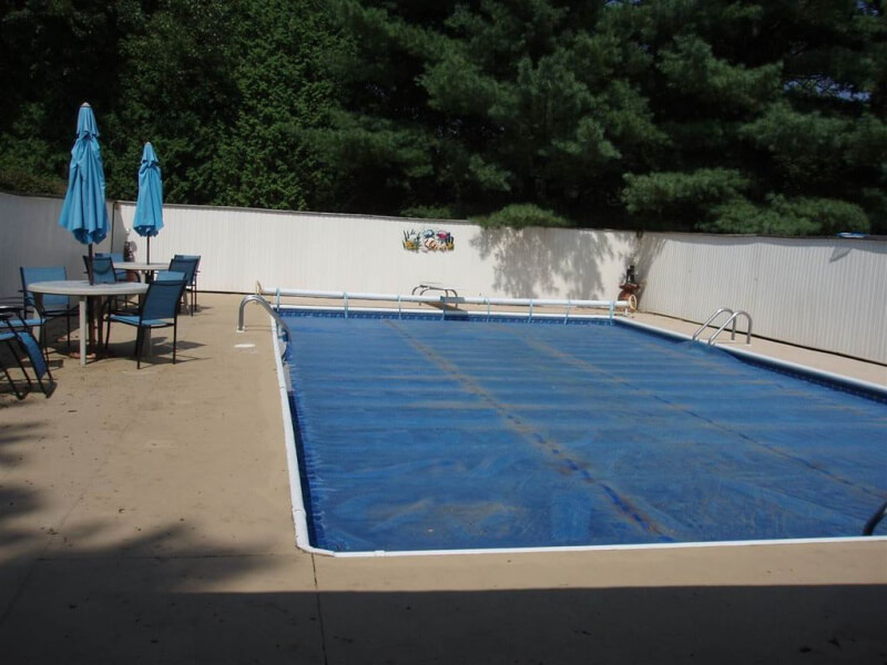 Resurfacing concrete is expensive no matter what material you use. But we did it ourselves and save a lot of money. Here's how we resurfaced our concrete for less. #poolconcrete #coolpooldeckcoating #concreteresurfacing #paintingconcrete #pooldecor #beforeandafterpooldecor